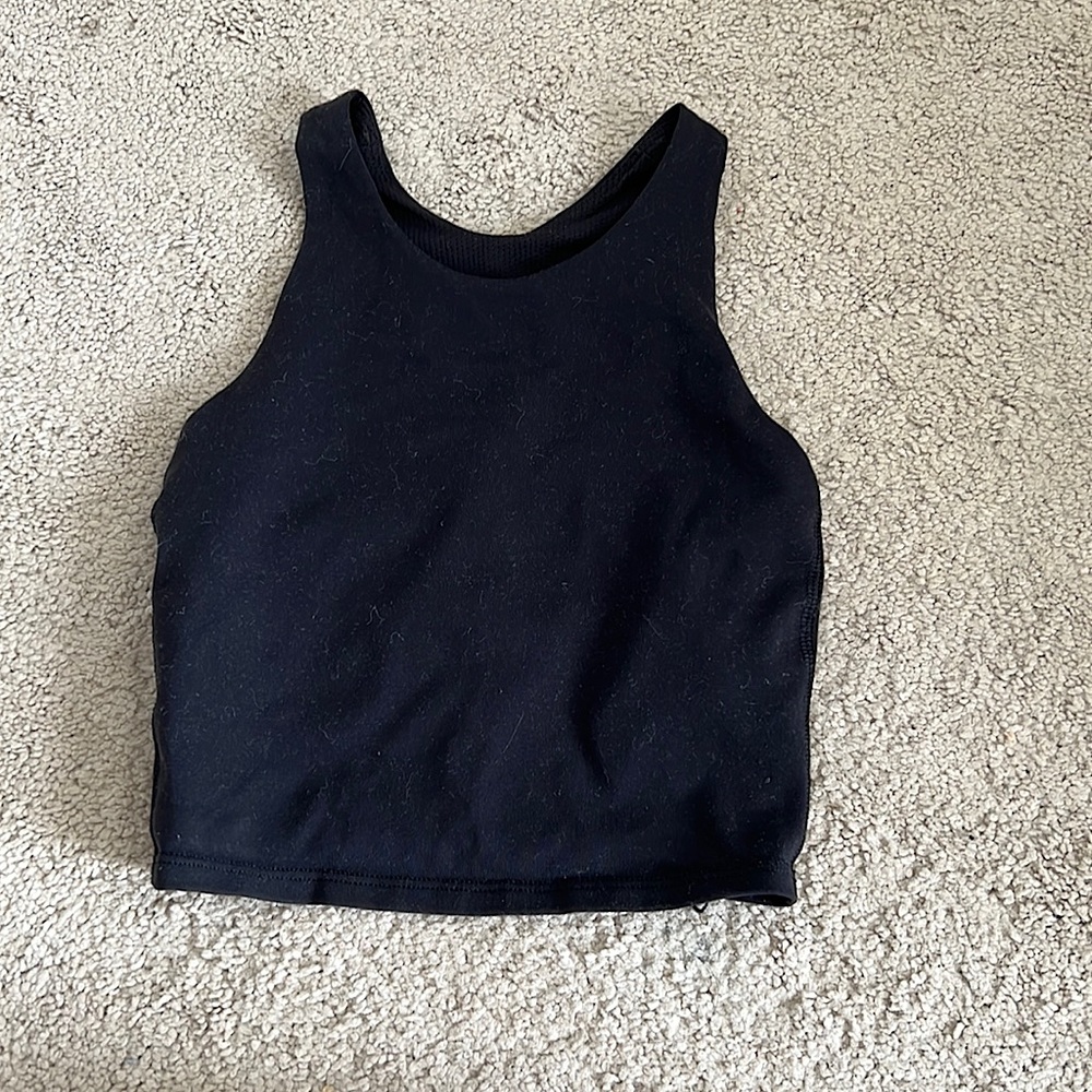 This is a Athleta tank top. Size kids 7 girls. Come in one color, black.